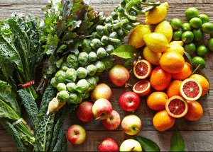 a group of fruits and vegetables on a wood surface Healthy Weight Loss Diets Leamington Spa